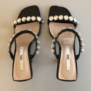 Black sandals with crystal embellishments